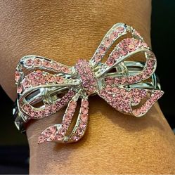 Pink Rhinestone Bow Silver Tone Stretch Bracelet. 7 inches. Adjustable.