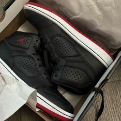 5y black and red jordan’s
