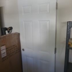 791/4"x313/4" Prepainted Entry Door. In Very Good Condition!