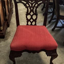 2 Dining Room Chairs With Engraved Designs Ans Deep Red Seats