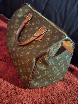 Louis Vuitton “Speedy” Handbag