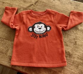 18 mo Cute “Silly Monkey” orange fleece top by Jumping Beans.  Good Condition  Unisex.