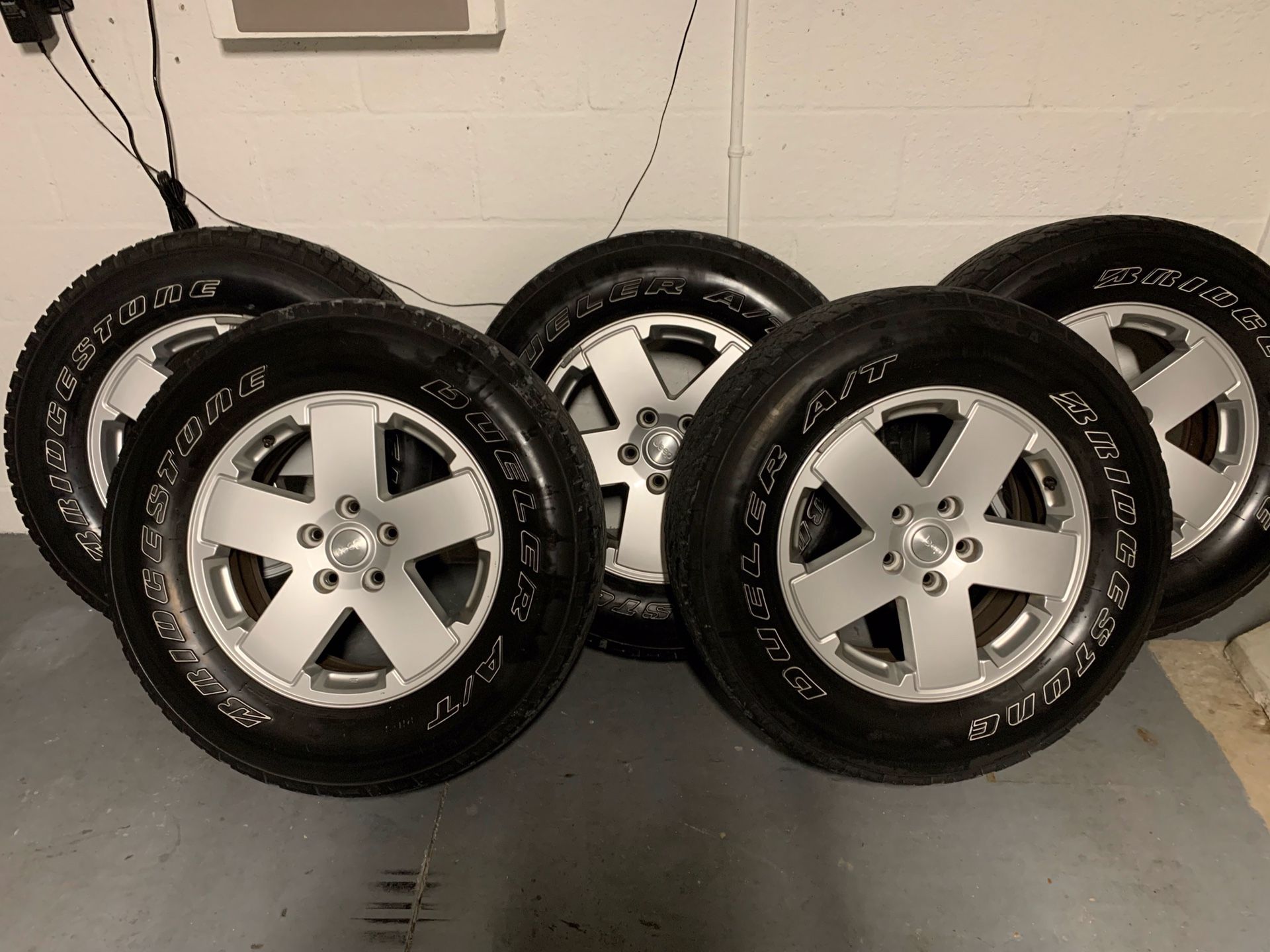 Set of 5 used wheel and tires. Fits Jeep Wrangler FREE FREE