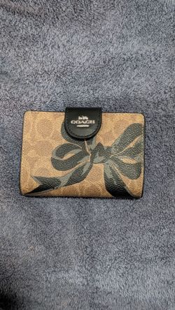 Coach Medium Corner Zip Wallet in Signature Canvas with a Black Bow Print