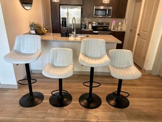 Four Matching Swivel Barstools