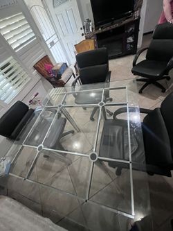 54x54 Dining Glass Table With Four Leather Rolling Chairs