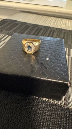 14k gold ring 9 grams cz diamond one came out but I have it can be put back in just selling for the gold