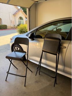 two black bar stools