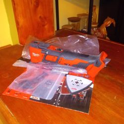 Milwaukee. 18 V New. Multi Tool.  W/ Paper Sander.  Blade