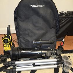 Celestron D70 telescope with a pair of walkie talkies and travel bag
