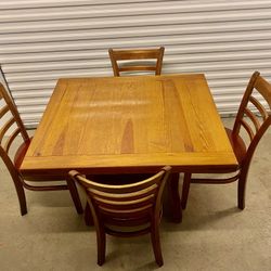 Square Wooden Dining Table And Four Sturdy Chairs