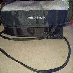 This appears to be a Studio 35 Beauty Travel Hairsetter 10 Dual Voltage Hot Rollers set.
