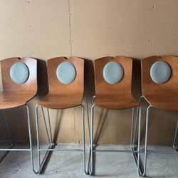FOR SALE: SET OF 4 Modern Designer Bar/Counter Stools (Wood & Metal) Give your kitchen island or bar area a touch of style with this elegant set of 4 