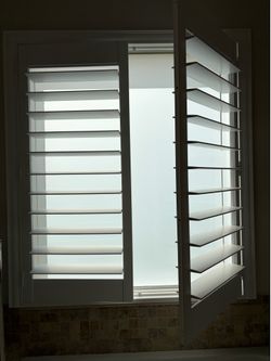 White Plantation shutter