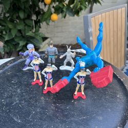 The Tick Action Figures Lot – Weighted Tick, American Maid & Villains (7 Pieces, 1990s)  ⸻  Description  Lot of seven figures from The Tick universe, 