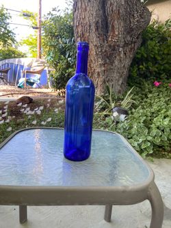 Blue glass bottles for wine enthusiasts or crafts