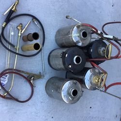 Pest control tanks with 1 complete and multiple parts some new.