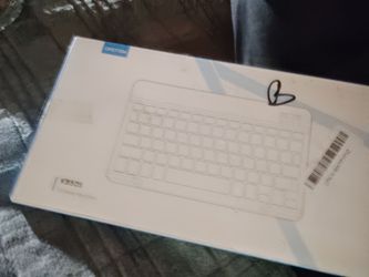New in box never opened backlit mini keyboard Bluetooth