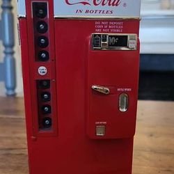 Vintage 1990's coca cola die cast table top battery operated cooler style musical vending machine plays coca cola jingle tune located in palm springs 