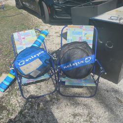 2 Beach Chairs And A Tommy Bahama Umbrella And 2 Brand New Pool Floats 