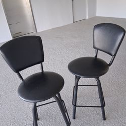2 black leather stools
