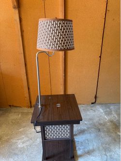 Lamp with charging table