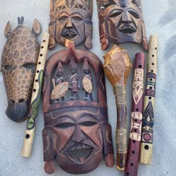  African masks, flutes, and a ceremonial club.