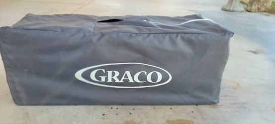 Graco Pack 'n Play portable playard in its carrying bag.