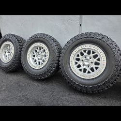 17" KMC rims w- 33" COOPER tires A/T