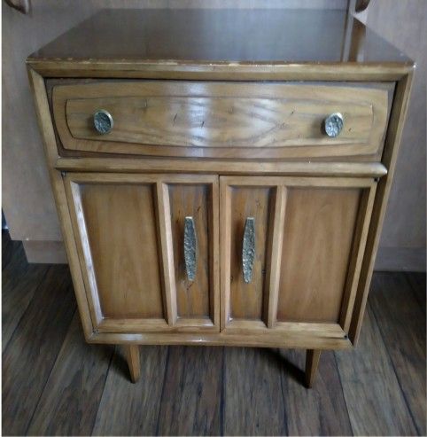 Retro style footed cabinet or side table in wooden Mid-Century design cabinet providing lots of storage space.