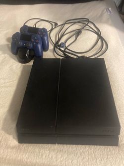 Sony PlayStation 4 Console with Two Controllers and Games