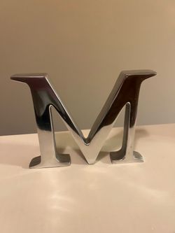 Silver metal letter M decor / weighted