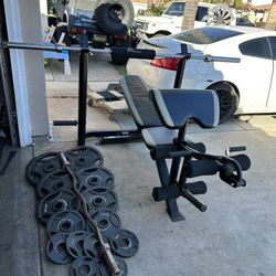 Bench press/squat rack with 7ft 45lbs bar plus 255lbs of Olympic weights and curl bar