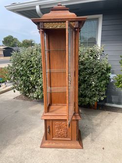 Vintage tall curio cabinet