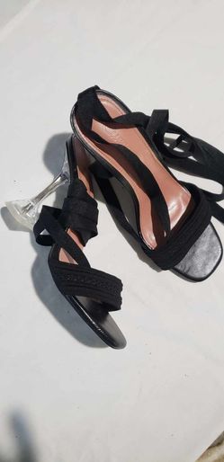 black strappy block heels feature a delicate tie-up ankle design and a comfortable open-toe construction