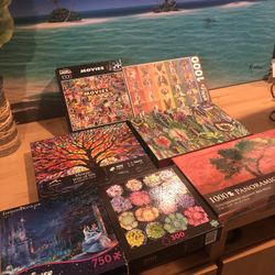 7 Puzzles (some Brand New/still Sealed!) $4 Each When Buy As Package Deal For $28 - Must Come To Me In Huntington Beach