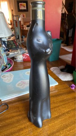 Four (4) collectible bottles in the shape of a cat
