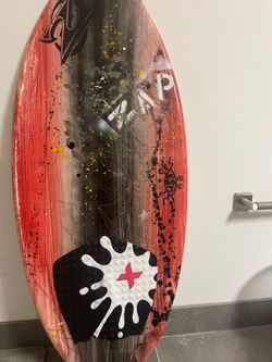 Zap red, black, and white woodgrain design skimboard