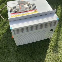 Window-mounted air conditioner.