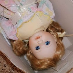 Porcelain Doll In The Box With A Little Baby