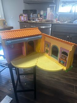 This is a 2003 Mattel "Dora the Explorer" Talking Playhouse Dollhouse.