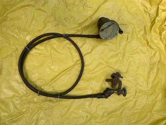 Antique automotive Jos W Jones 1904 speedometer with cable and attachments.