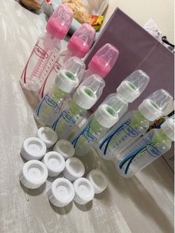 Dr brown bottles, size 2 nipples, dishwasher rack, & cover for breast milk