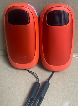 Two Orange Electric Hand Warmers - Powers On
