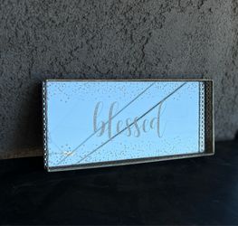 Mirrored surface with "blessed" typography
