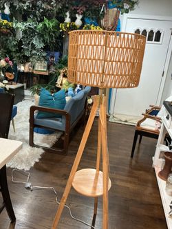 A beautiful Rattan Floor Lamp with a built in wooden display, two layer drum shades (on leg is a little weak