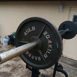 Squat racks and weights on olympic bar