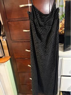 LOWERED AGAIN.    Woman’s medium black dress