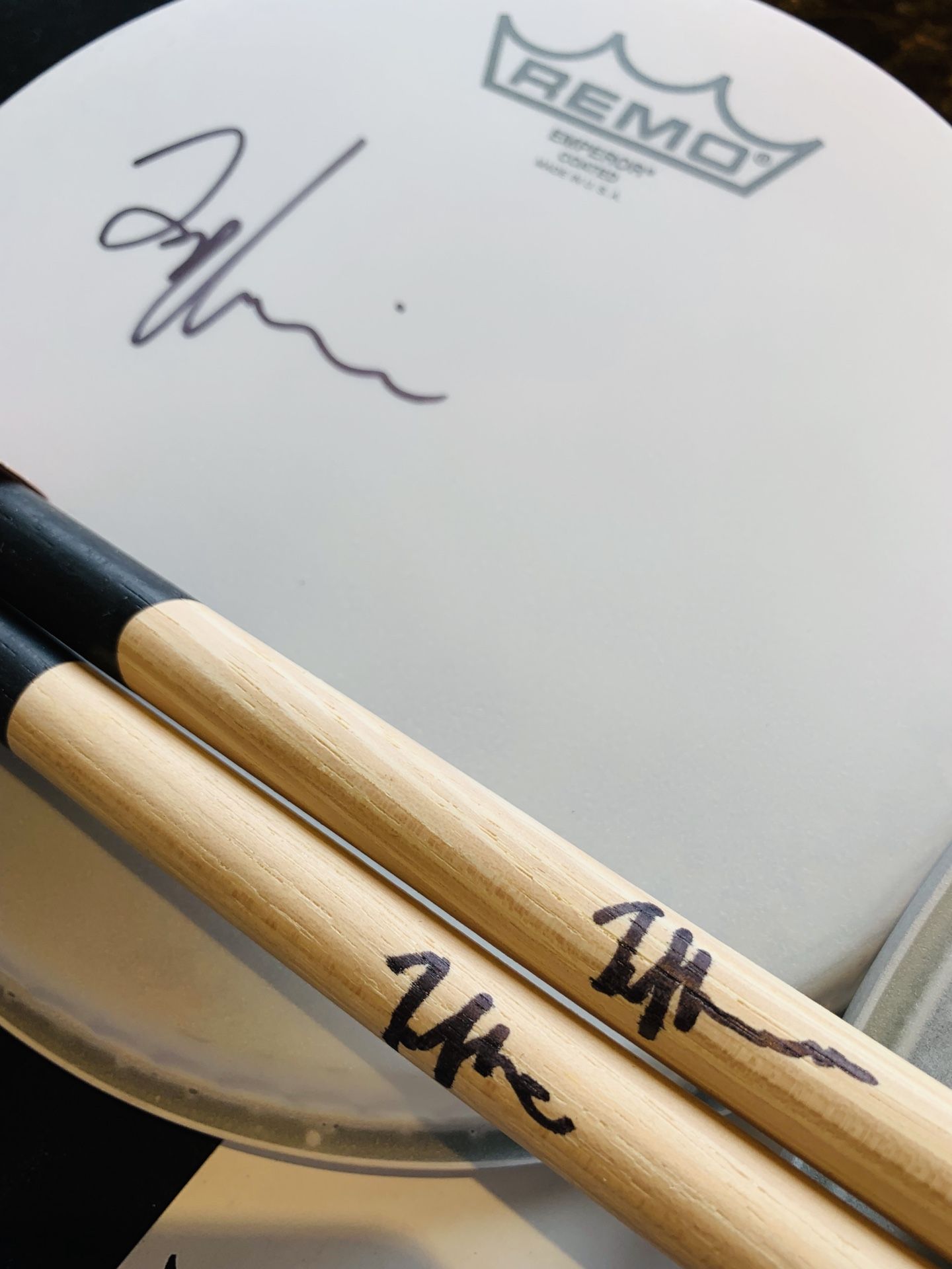 Taylor Hawkins Foo Fighters autographed drum heads and sticks.