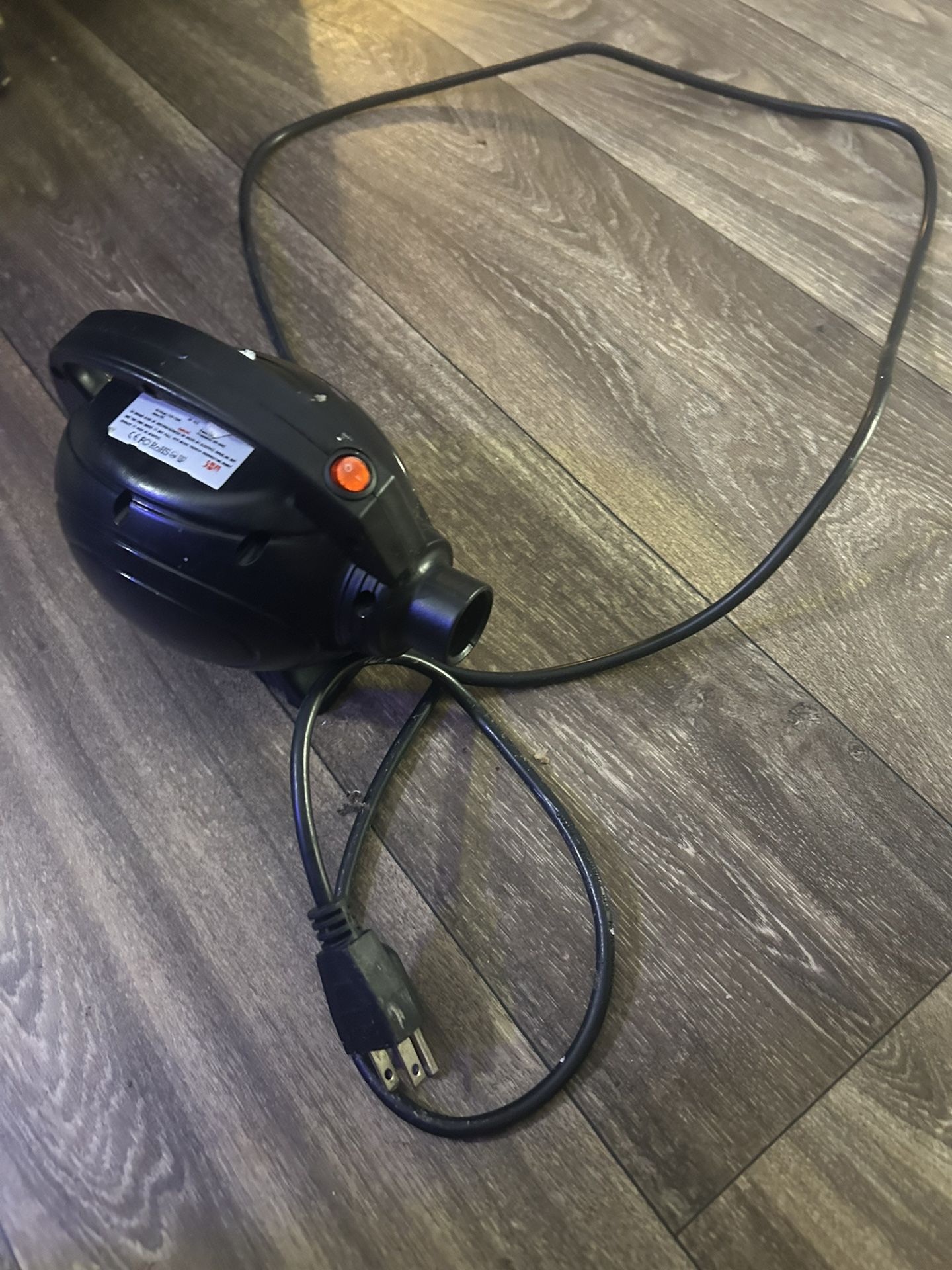 electric air pump, commonly used for inflating items like air mattresses, inflatable toys, or gymnastics equipment.
